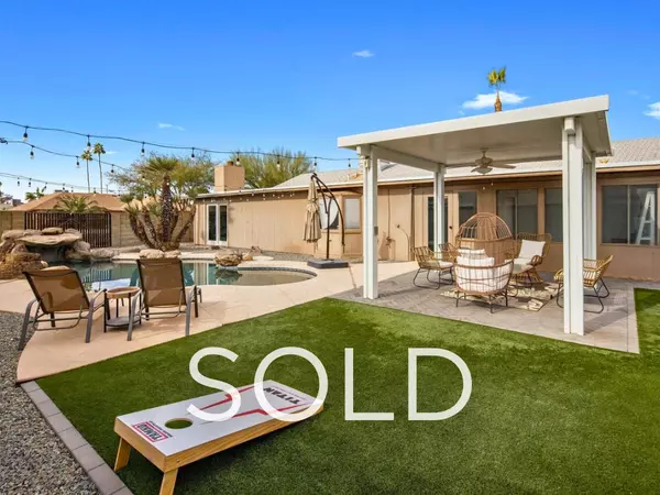 Sold home in Dobson Ranch Mesa AZ featuring remodeled backyard with pool, covered patio, turf lawn, and outdoor entertaining space—first-time buyer purchase with long-term, mid-term, and short-term rental flexibility.