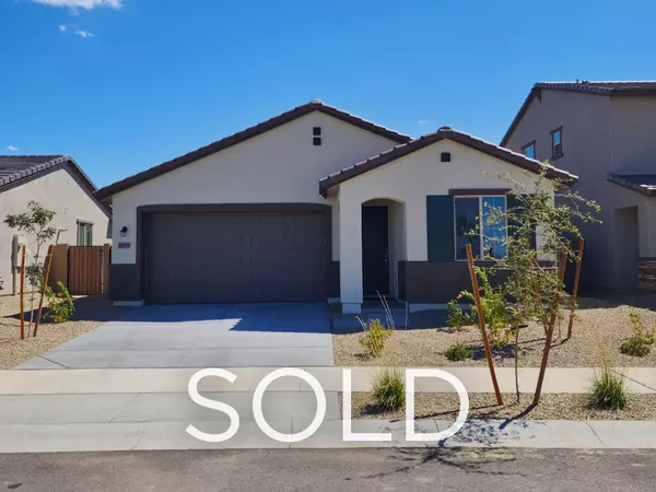 Sold new construction home in Surprise, Arizona purchased below builder list price, showcasing a modern single-story design with desert landscaping and two-car garage, part of a successful relocation and early retirement strategy for out-of-state buyers.