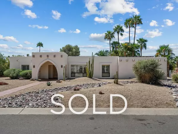 Sold single-story Santa Fe–style home in Scottsdale, Arizona (85254) featuring desert landscaping and palm trees, representing a successful client purchase of a fully furnished short-term rental with strong cash flow, bonus depreciation strategy, and expert buyer representation in the Scottsdale AZ real estate market.