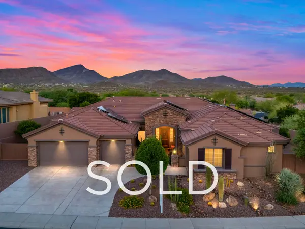 Sold luxury home in Anthem Country Club, Anthem, Arizona featuring mountain views at sunset, desert landscaping, and a single-story design, representing a successful seller strategy and record-setting sale for its size in the Anthem AZ real estate market.