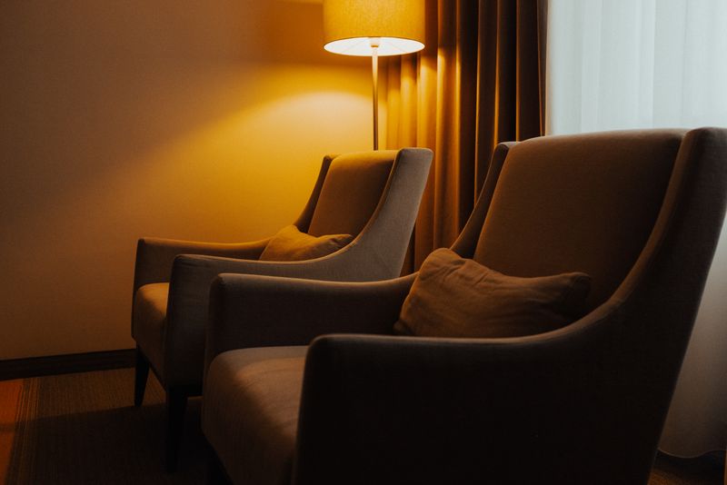 Cozy living room with armchairs and warm lighting