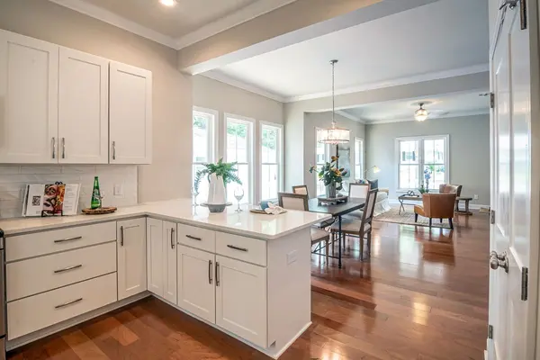 Bright open-concept kitchen prepared for showings