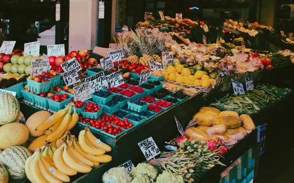 Colorful fruit and vegetable stall at an outdoor farmers market