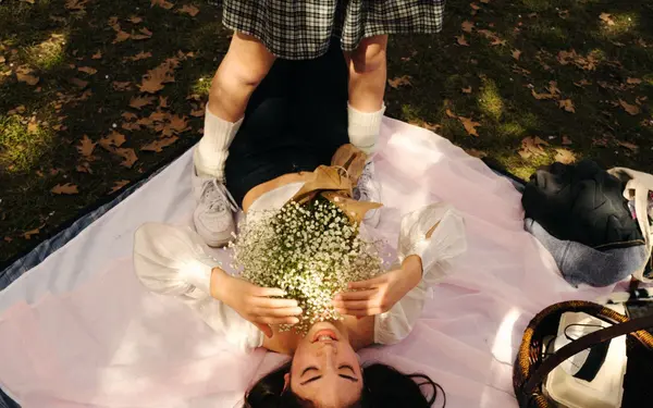 Picnic blanket on green grass in a sunny Pacific Northwest park