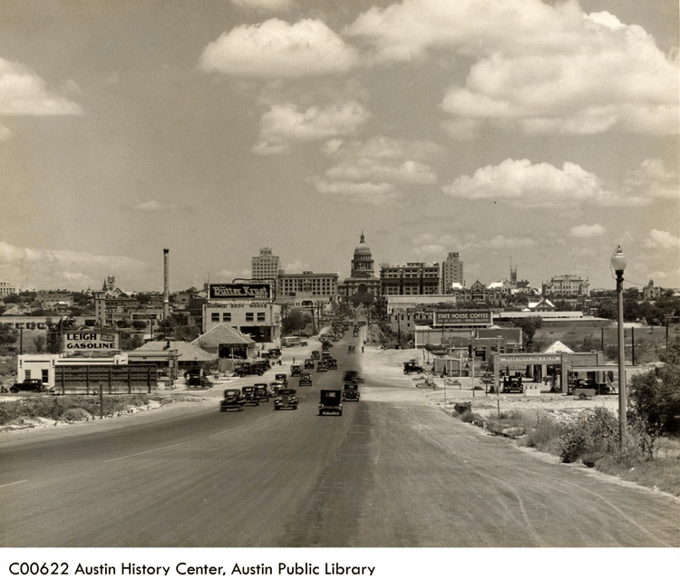 South Congress Avenue in Austin with shops, skyline, and street activity