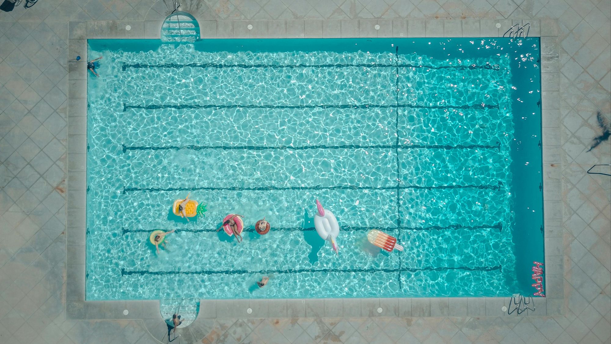 racked pool plaster showing spider-web lines, common sign of ASR in Austin pools.