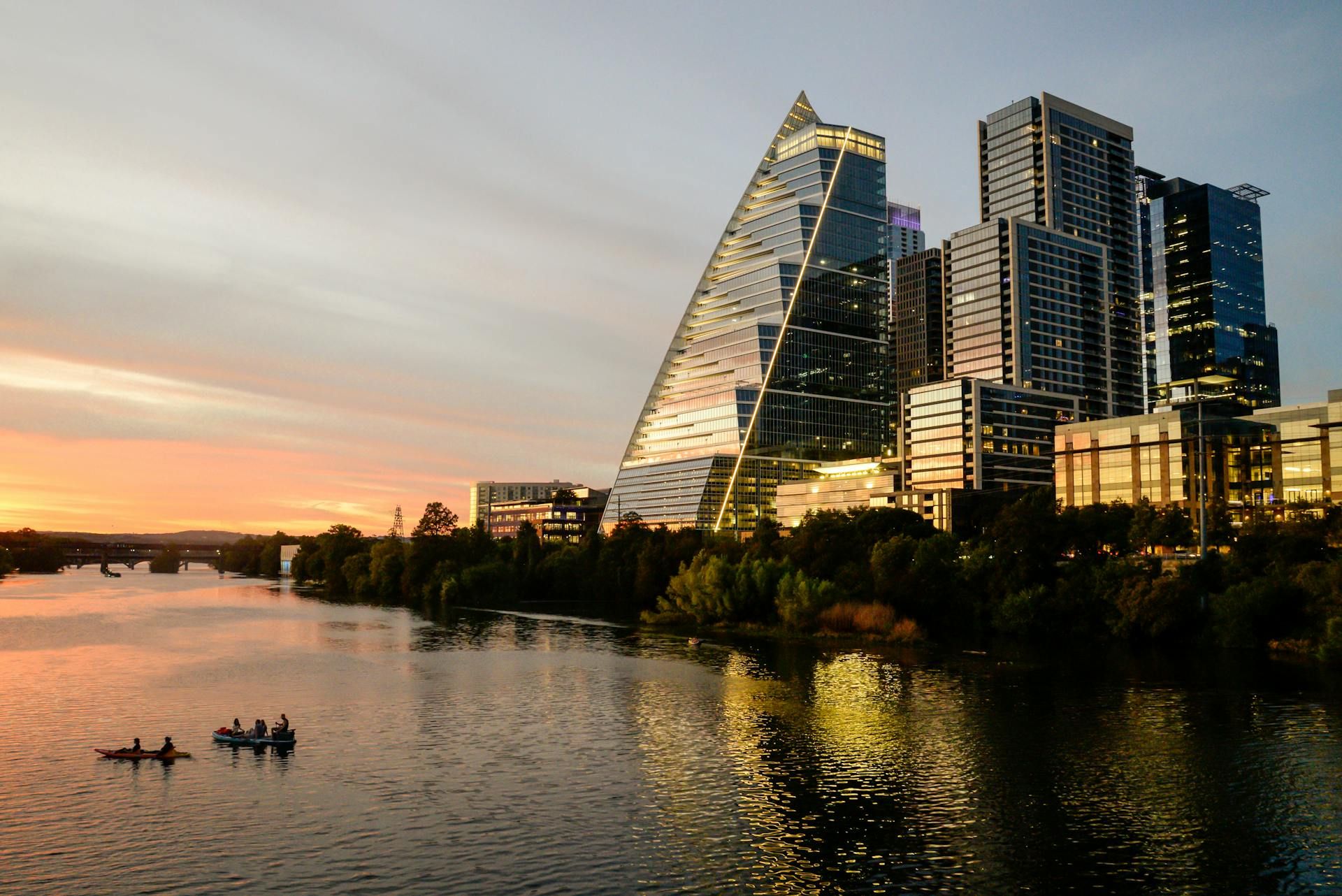 Austin skyline at sunset highlighting civic center and growth