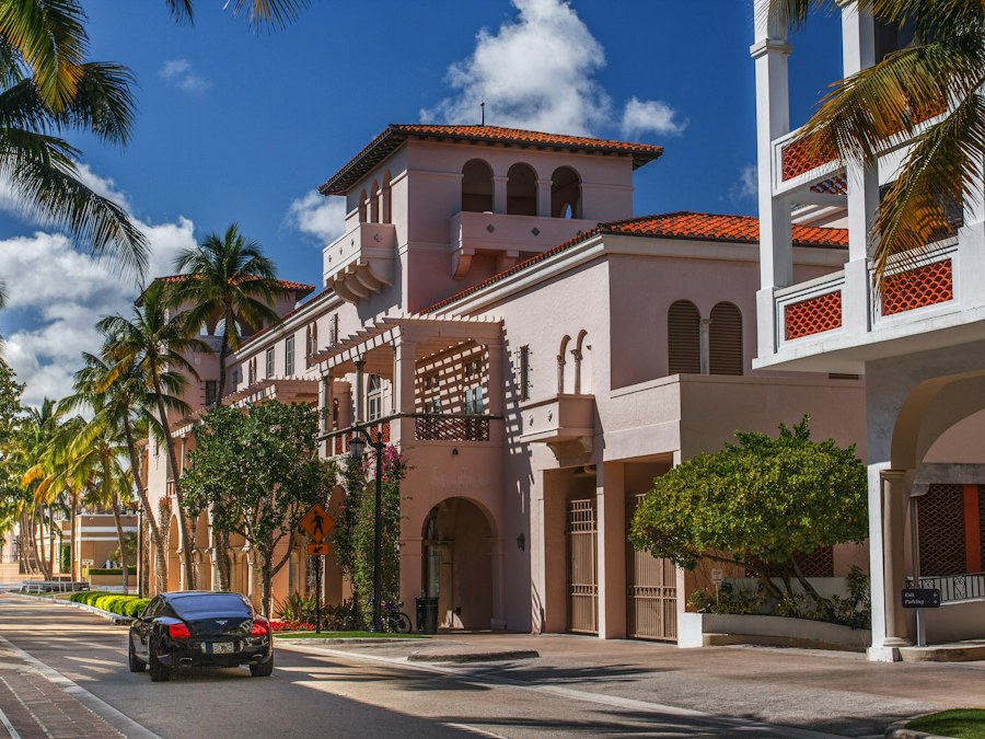 Palm-lined street with Mediterranean architecture in Old Naples