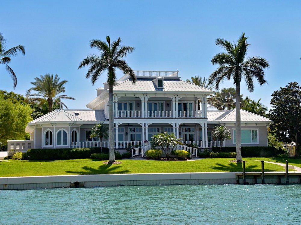 Luxury Naples residence with palm trees on the waterfront