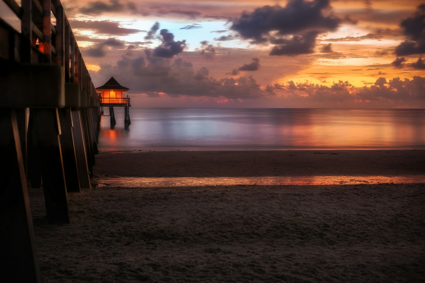 Sunset over the beach at Naples Pier, Florida