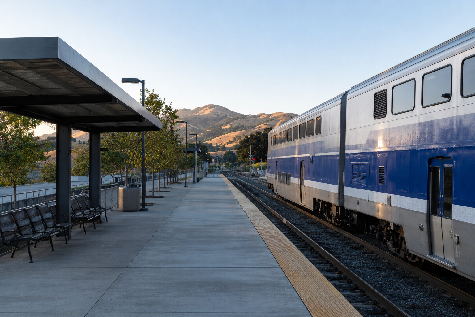 ACE train platform at Pleasanton station with commuters on a clear morning in the Tri-Valley region of California