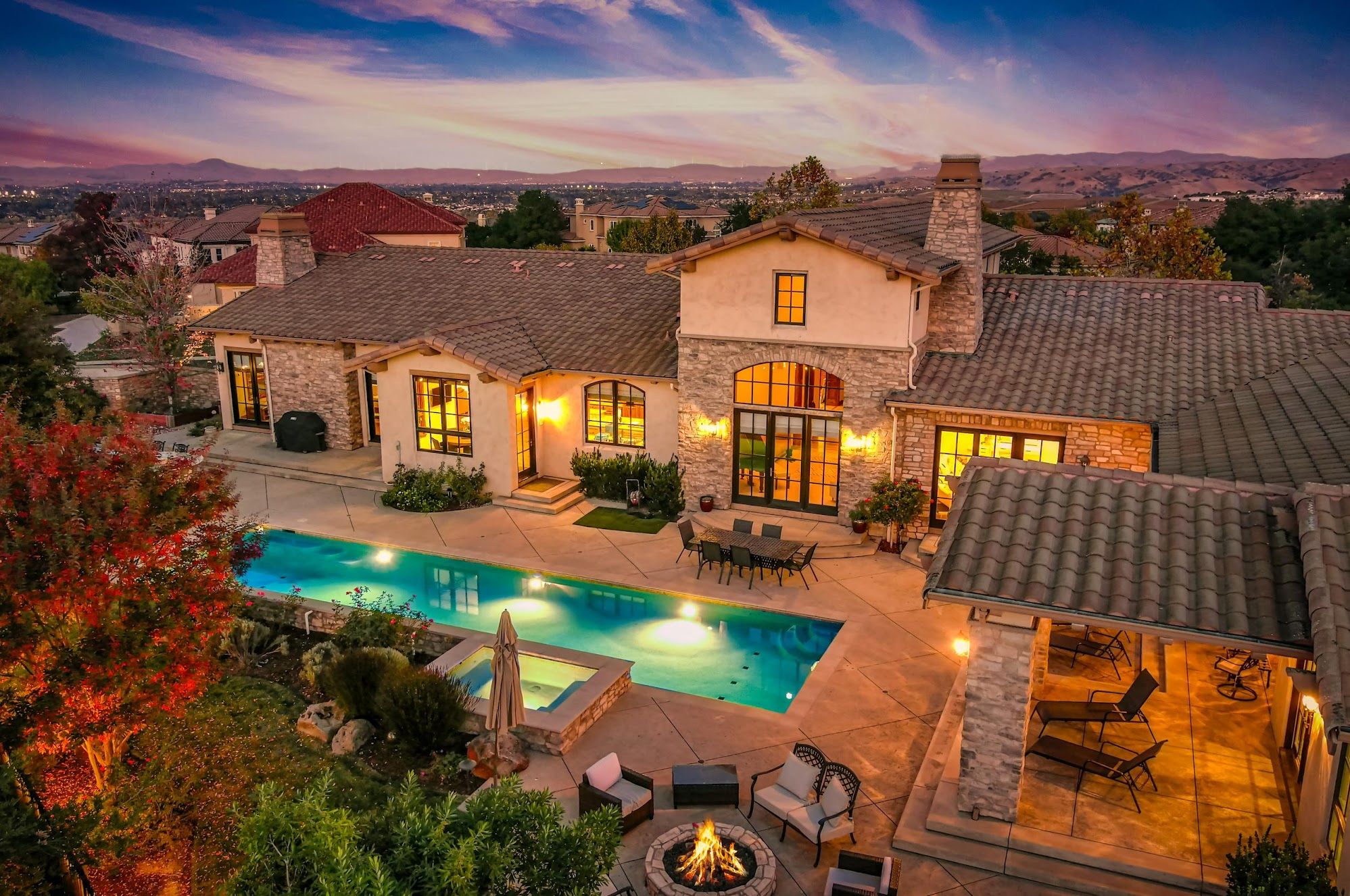 Pleasanton California neighborhood aerial view showing residential streets near Foothill High School with hills in background, no people or text