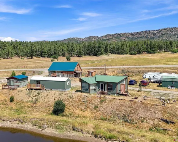 Turnkey Colorado Mountain Retreat with Private Lake, Creek Frontage, and Income Potential