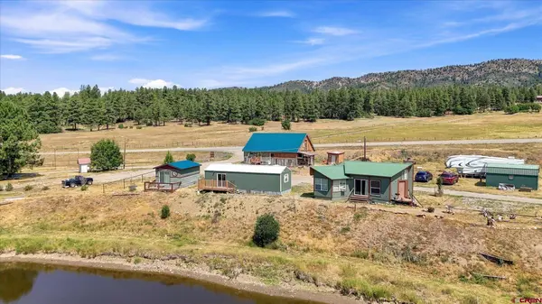 Turnkey Colorado Mountain Retreat with Private Lake, Creek Frontage, and Income Potential