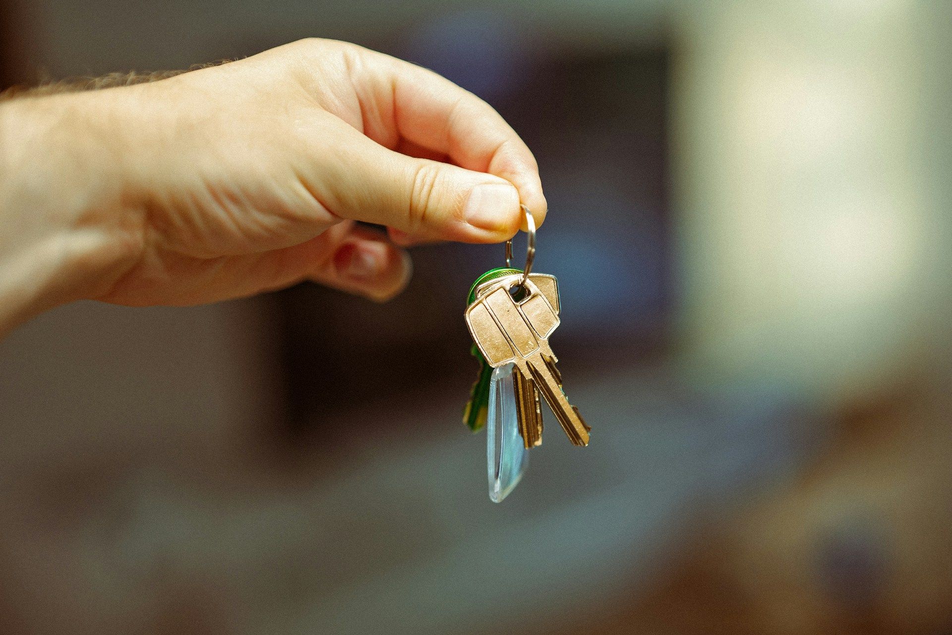 a hand holding house keys