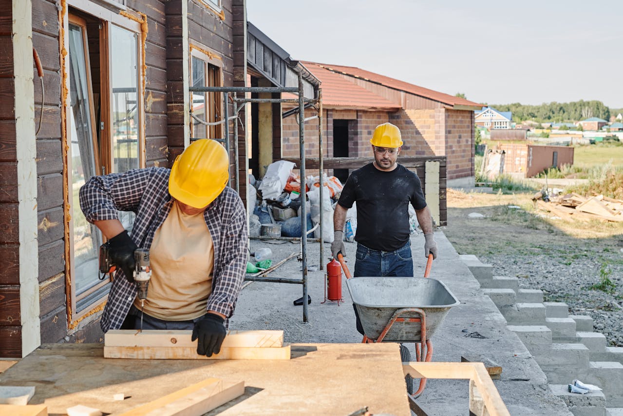 Construction workers working on a home exterior