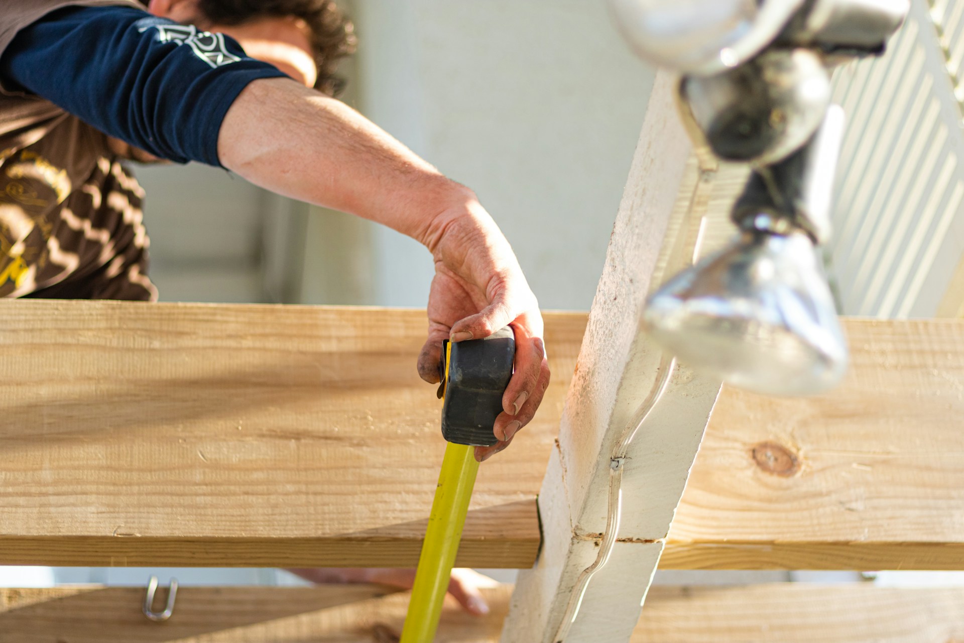 Man measuring a piece of wood