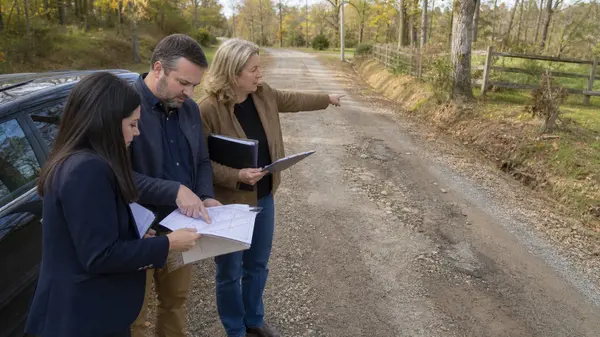 Buyers and agent reviewing private-road conditions and duties in Spotsylvania.