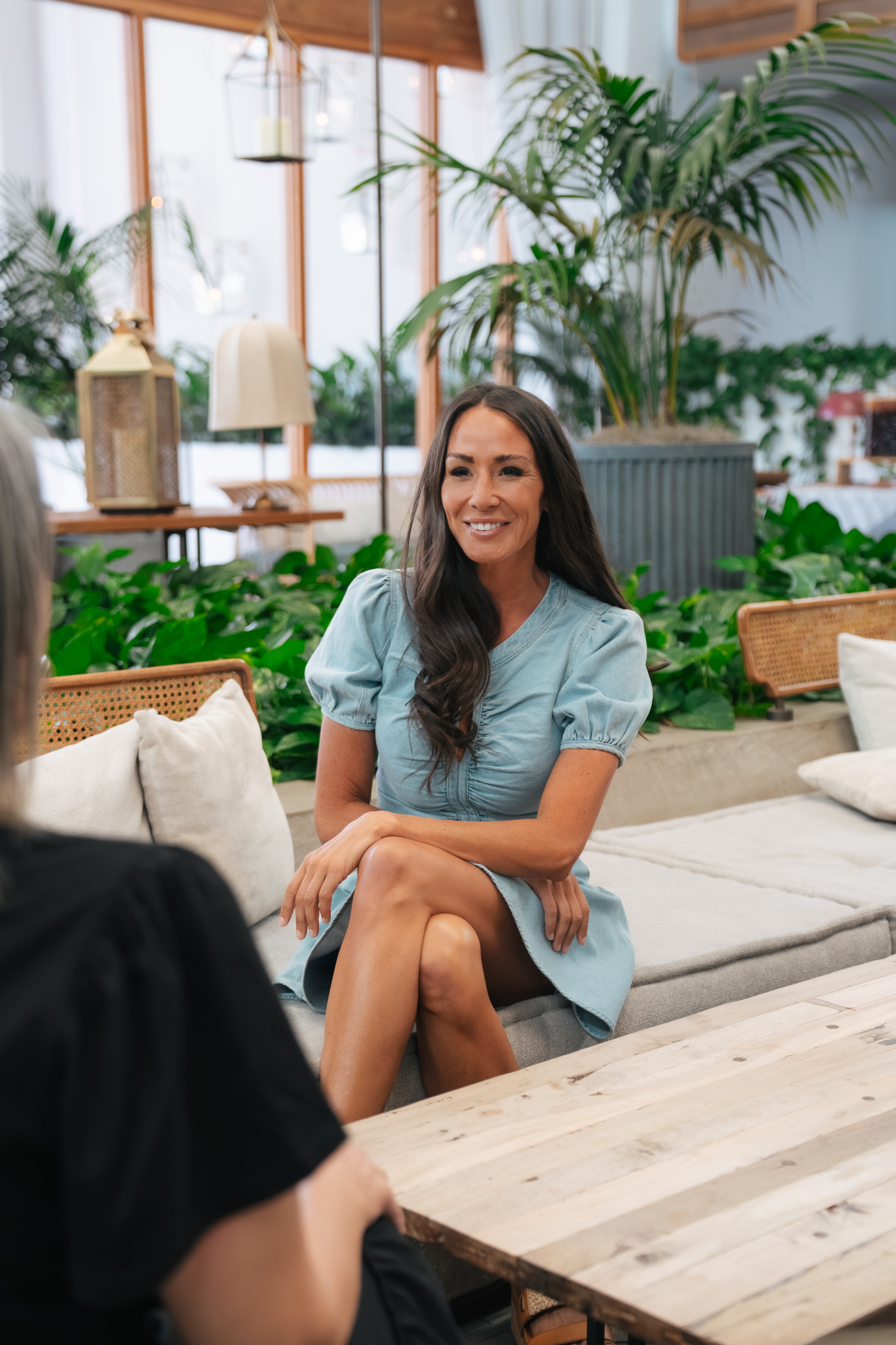 Lauren Artino seated with a client