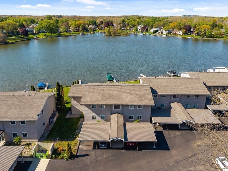 Aerial view of lakefront condominiums on an inland lake in Michigan