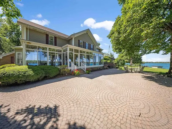 Waterfront home with sunroom sold by Realty Executives Home Towne on the St. Clair River