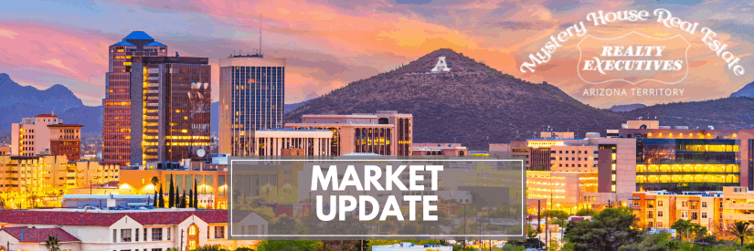  Heafer image for a real estate market update featuring downtown Tucson, Arizona, at sunset. The city skyline glows with colorful lights against the backdrop of "A" Mountain. The text "Market Update" appears in a bold white box across the center, with the MysteryHouse Real Estate and Realty Executives Arizona Territory logos in the upper right corner. 