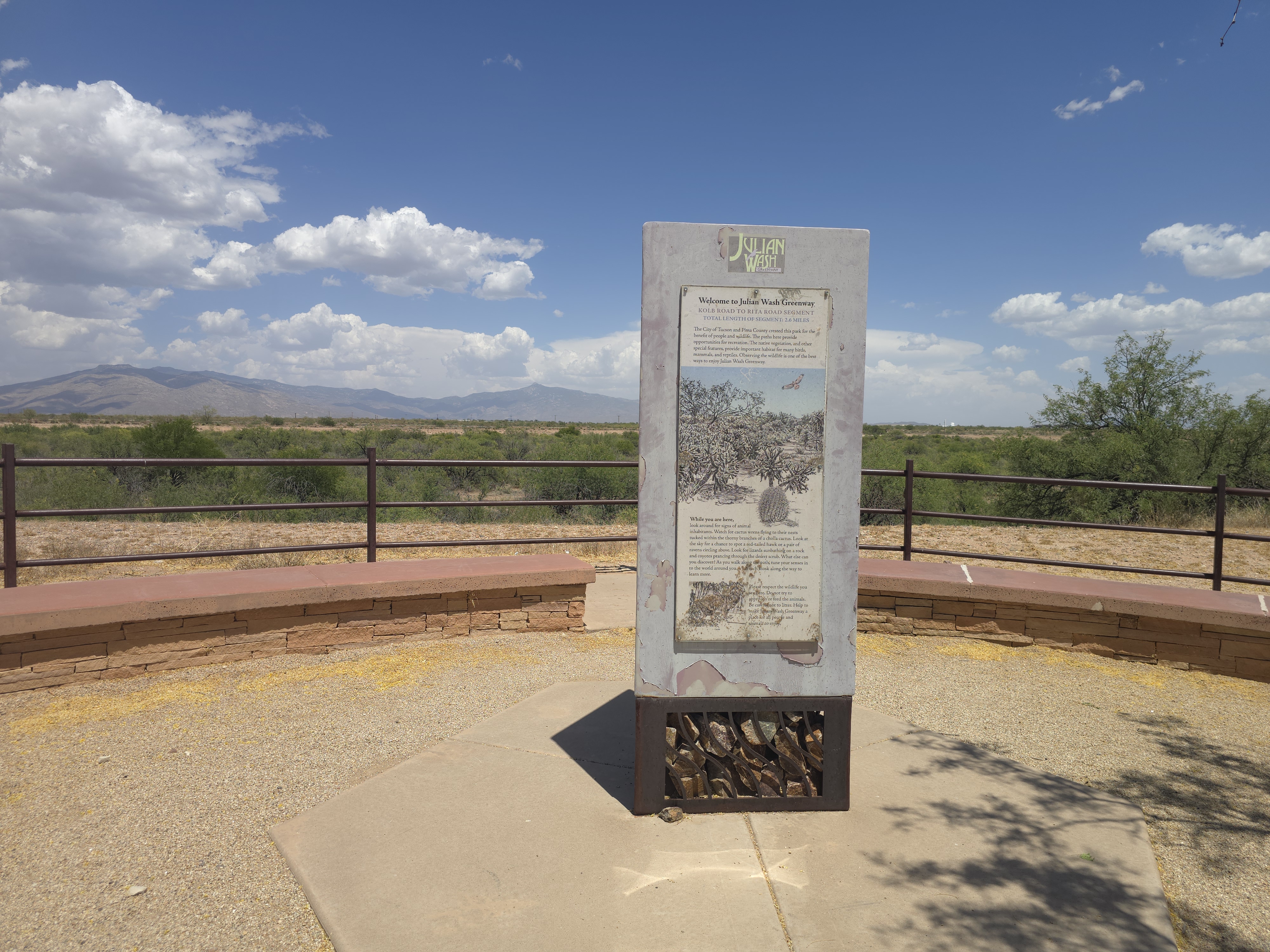 Welcome sign for the Julian Wash Greenway Kolb Road to Rita Road segment in La Estancia de Tucson, with Rincon Mountains in the background