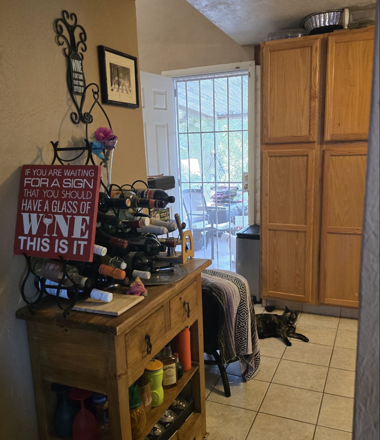 A home entryway with an open sightline through the kitchen to the back yard