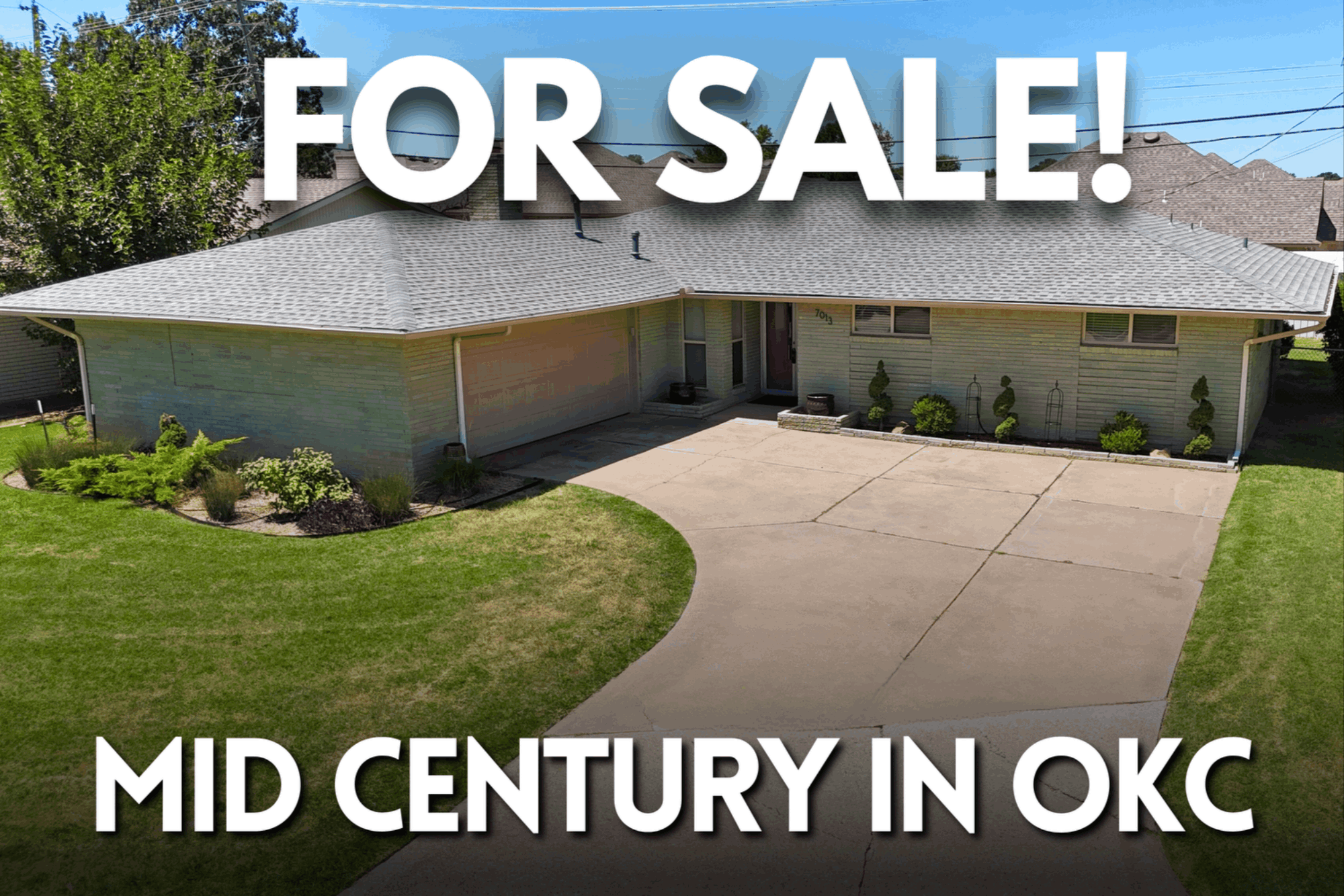 Front view of a mid-century modern home for sale in Oklahoma City, featuring a low-sloped roof, original brick facade, manicured lawn, and bold white text overlay that reads ‘FOR SALE! MID CENTURY IN OKC’