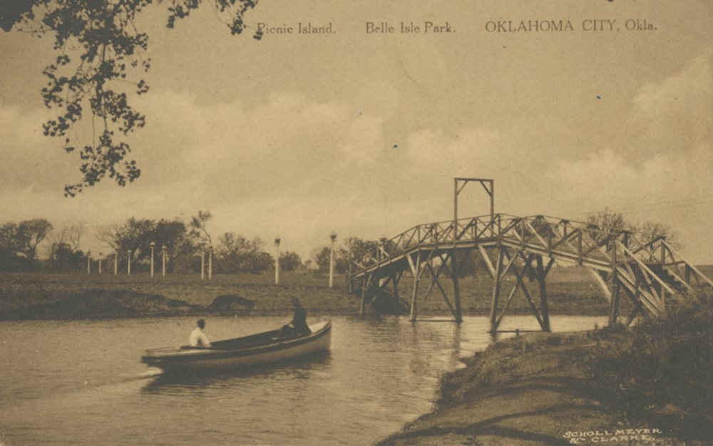Historic Picnic Island postcard showing a boat beneath a footbridge at Belle Isle Park in Oklahoma City.