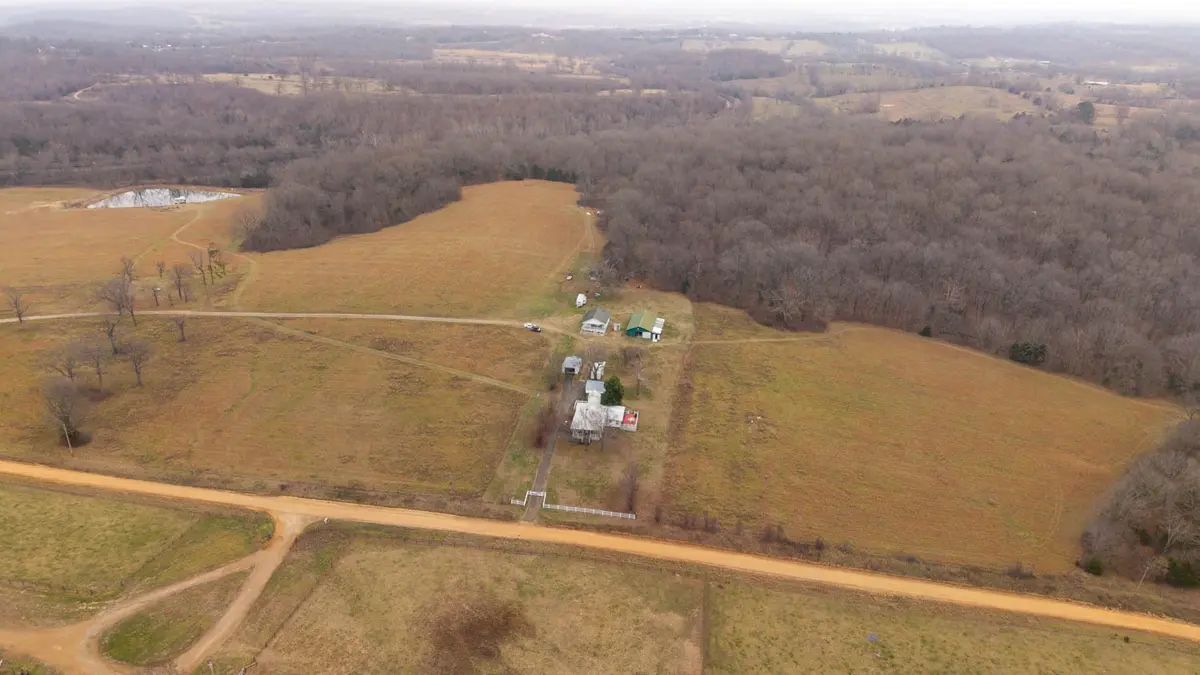 120 plus acres with 2 houses and a srping fed pond and creek000