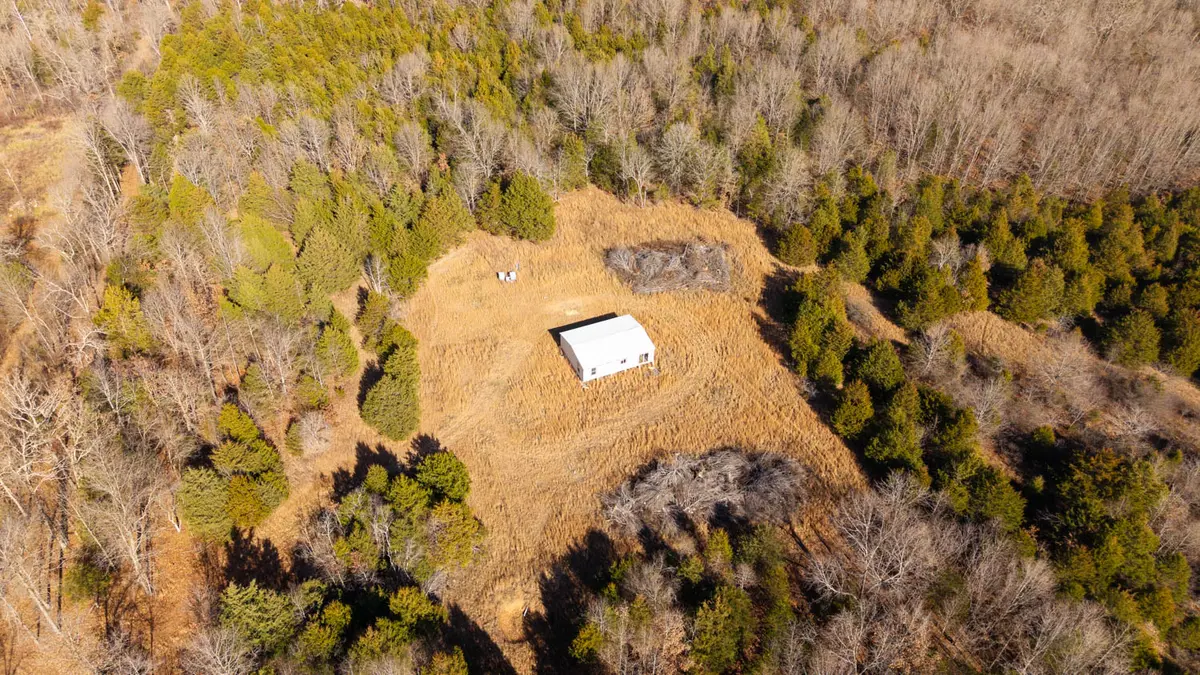 Wooded Acreage for sale with unfinished home in oregon county 0