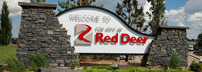 Welcome to Red Deer Alberta sign at city entrance, representing real estate opportunities and community living in Central Alberta.
