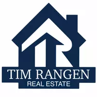 Tim Rangen Real Estate Logo: Stylized white "TR Tim Rangen Real Estate" on dark blue house shaped background