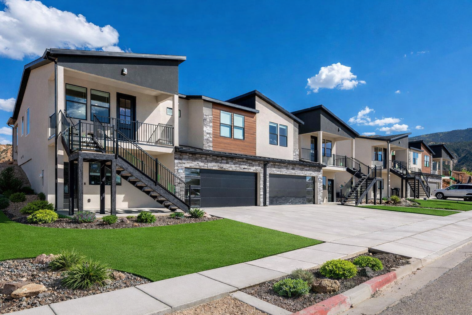 Cedar City Utah lock-off townhome exterior front view with landscaping and garages