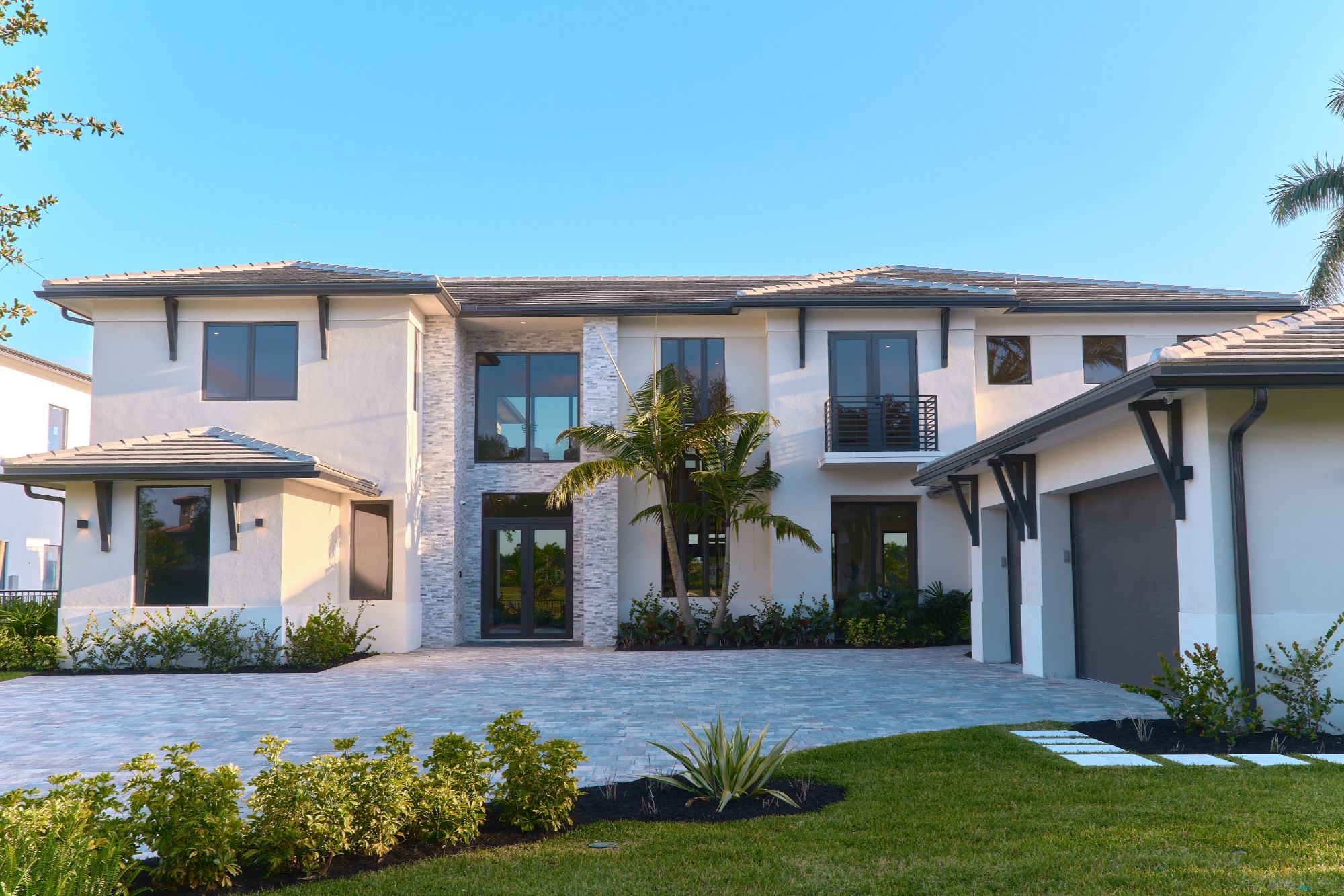 Parkland home with a landscaped terrace and open lawn