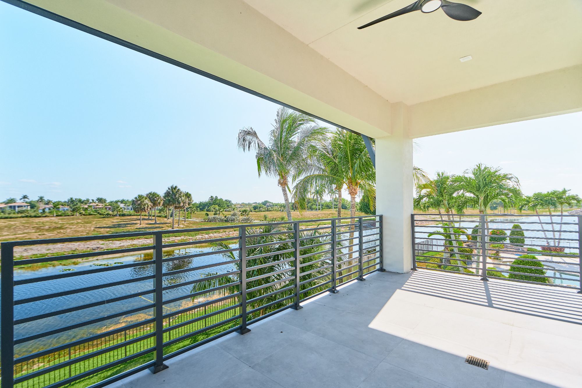 Covered terrace overlooking a landscaped Parkland backyard