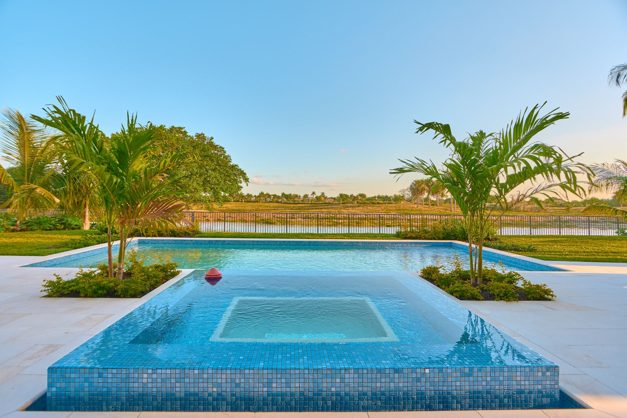 Pool terrace and landscaped grounds at the photographed Parkland community