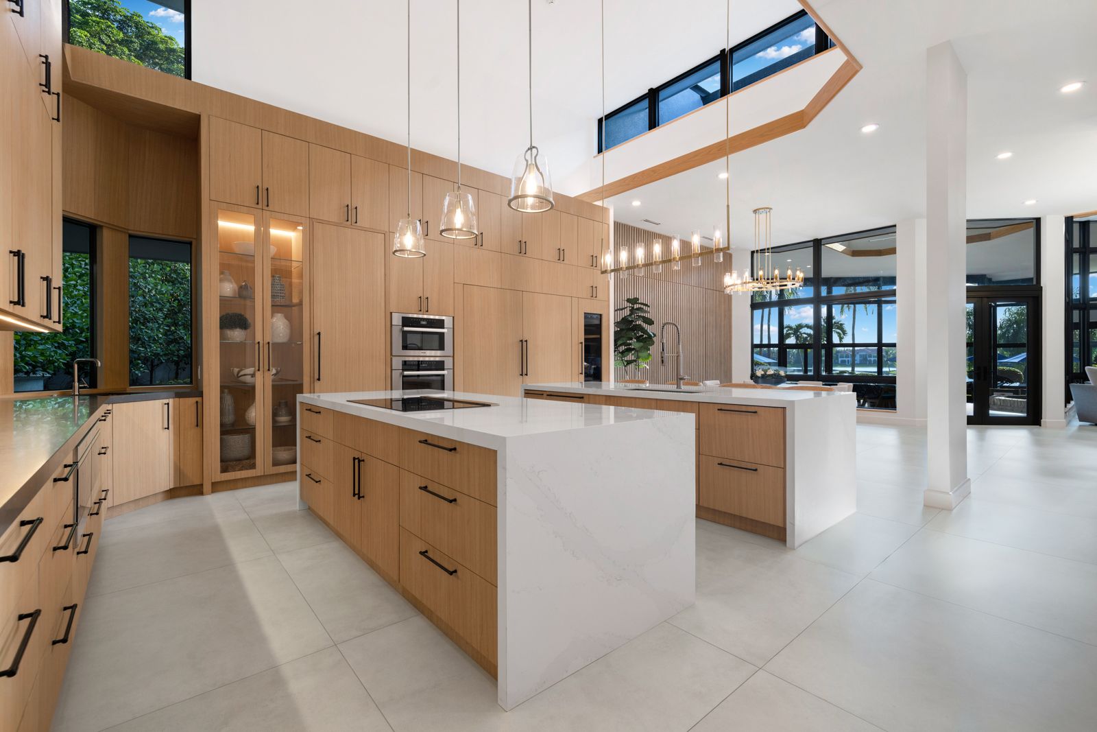 Refreshed luxury kitchen in a Weston FL home with stone counters and natural light.