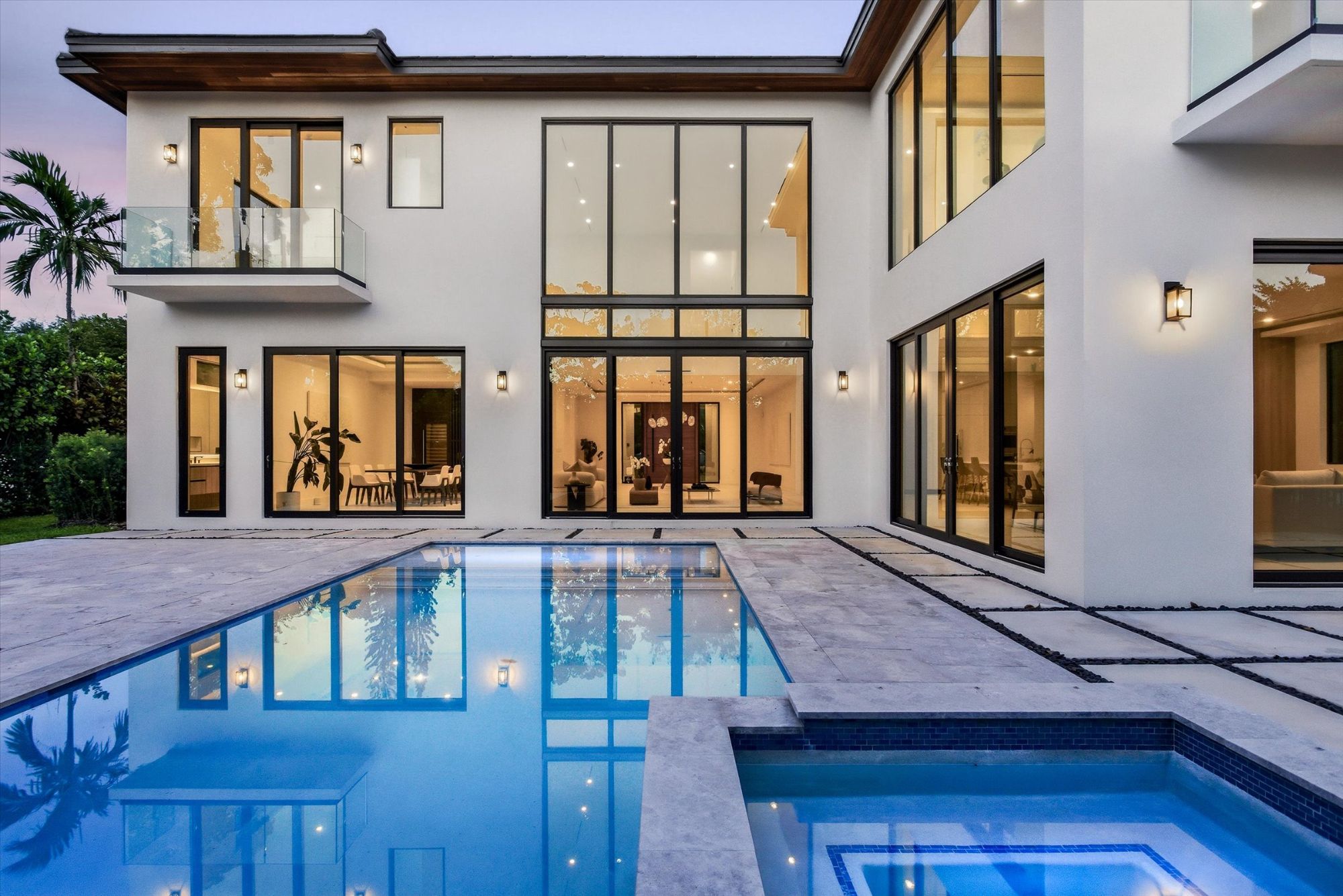 Architectural detail of a luxury estate in Southwest Ranches Florida, showing custom stone work and high-end exterior finishes.