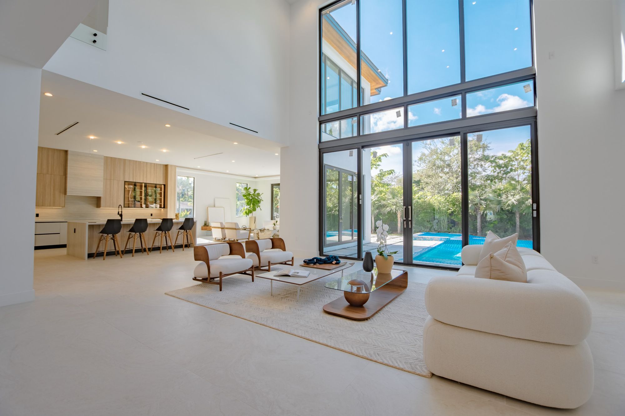 Bright luxury home interior in Weston Florida with natural light, open living room, and elegant neutral design