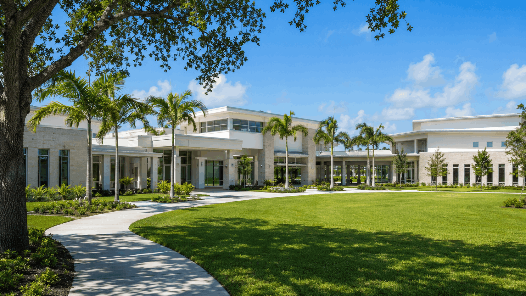 Exterior shot of a modern Florida school campus, bright blue sky, clean architecture, green grass. No identifiable children.