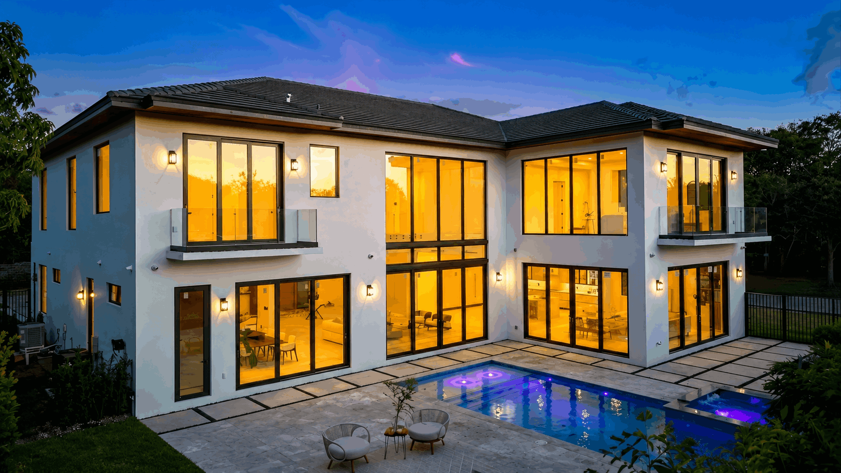 Aerial twilight view of a private Weston luxury estate with pool.