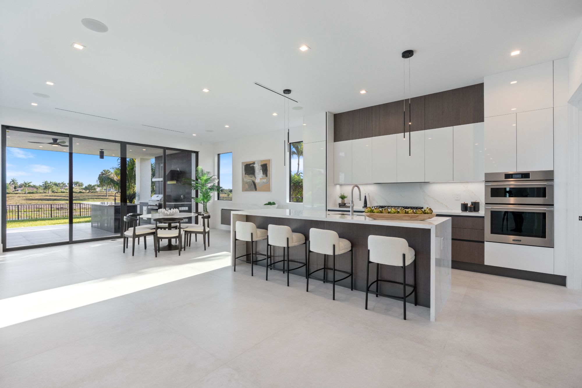 Bright, elegantly staged living room in a Weston Hills luxury home.