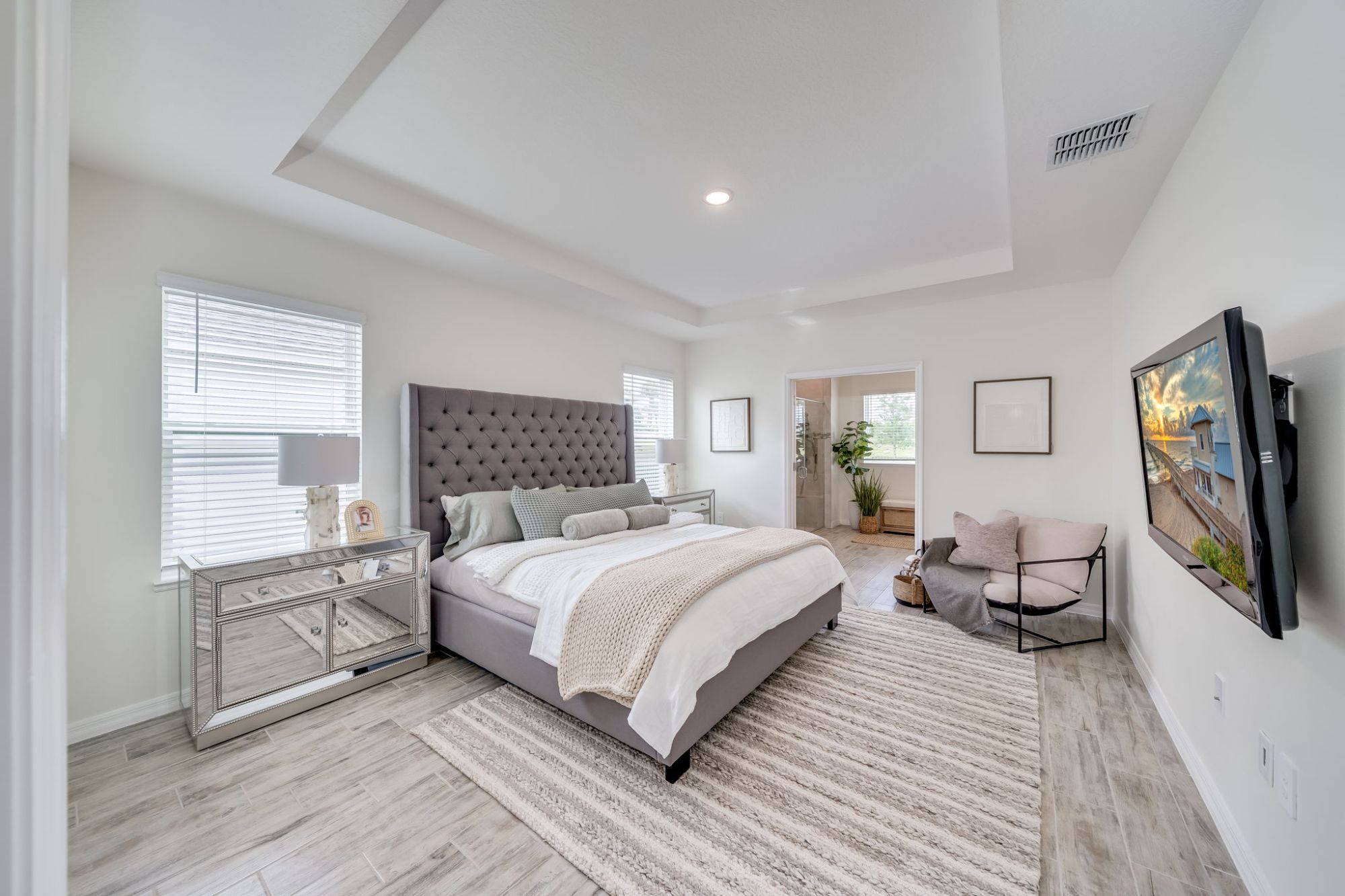 Staged primary bedroom suite in a Weston luxury home.