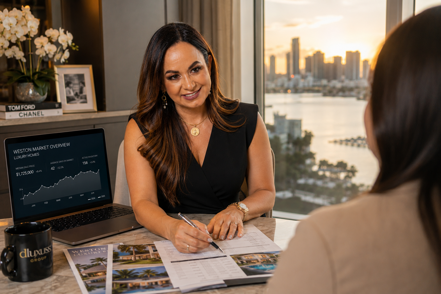 Denice Landaeta reviewing a Weston home valuation with a seller.
