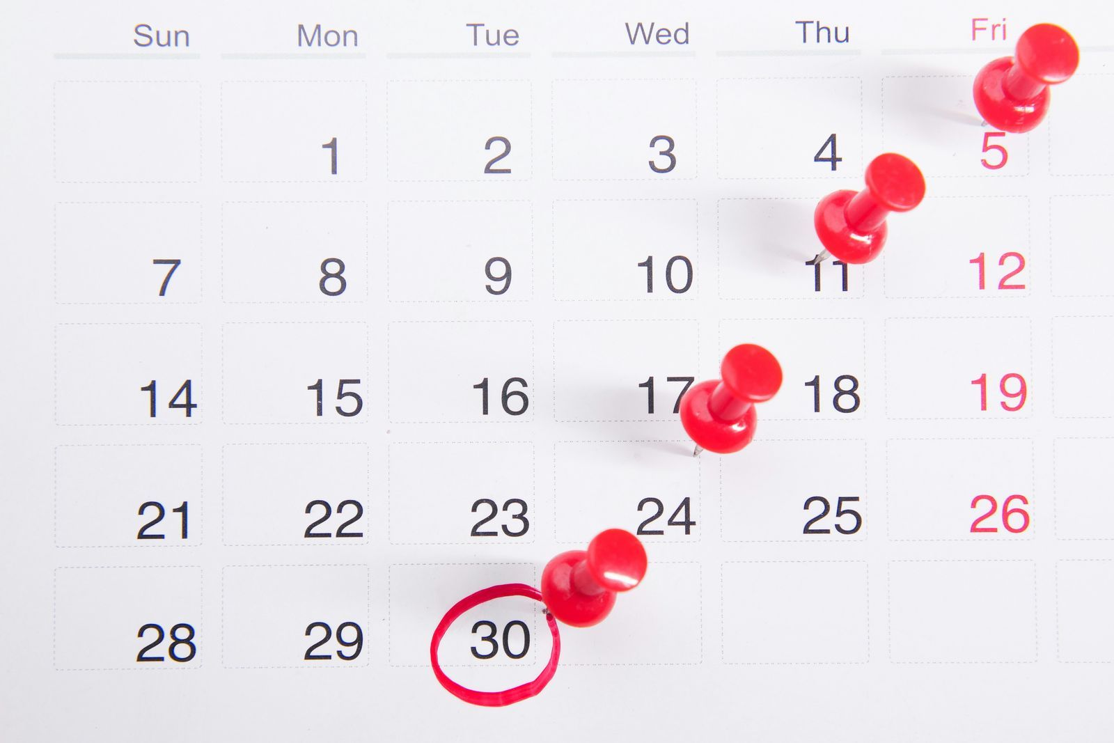 Calendar with pins marking key dates in a relocation timeline