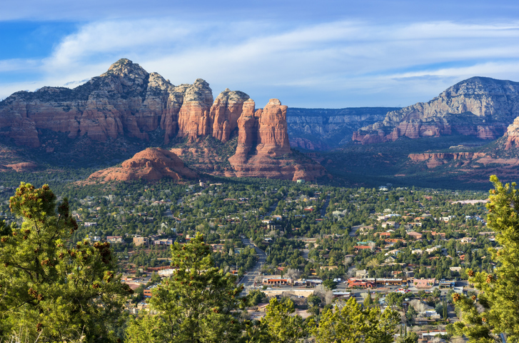 Aerial view of West Sedona with Coffee Pot Rock formation in the background