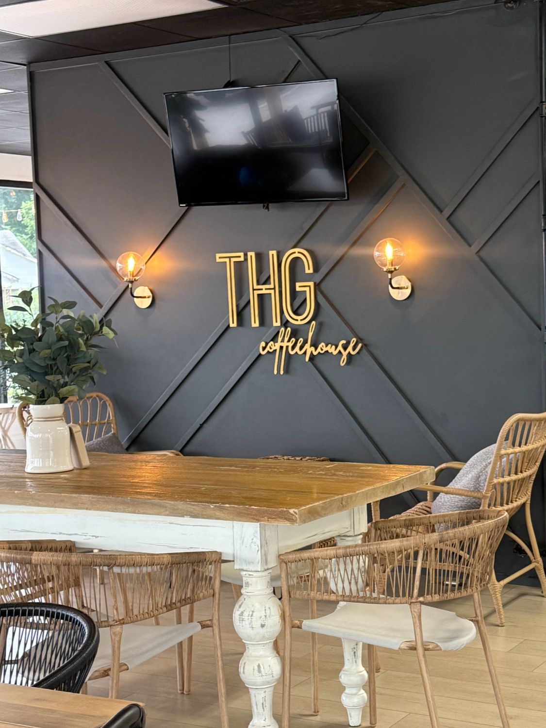 Interior of The Holy Grind coffee shop in Kannapolis NC with drinks and seating area.