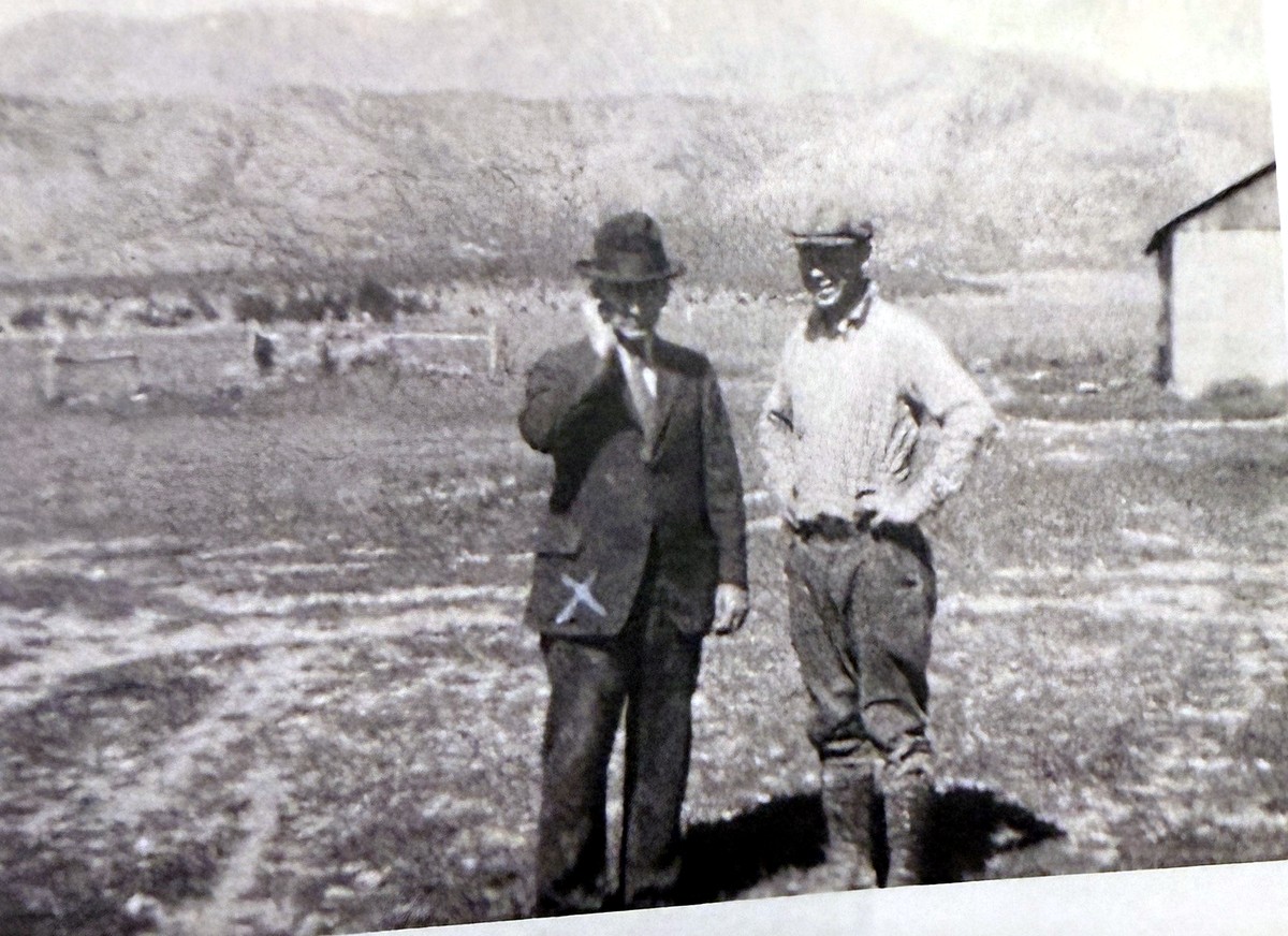 Horace C. Holbrook on the family farm in Lehi, Utah in 1932, with the Lehi ridgeline behind him
